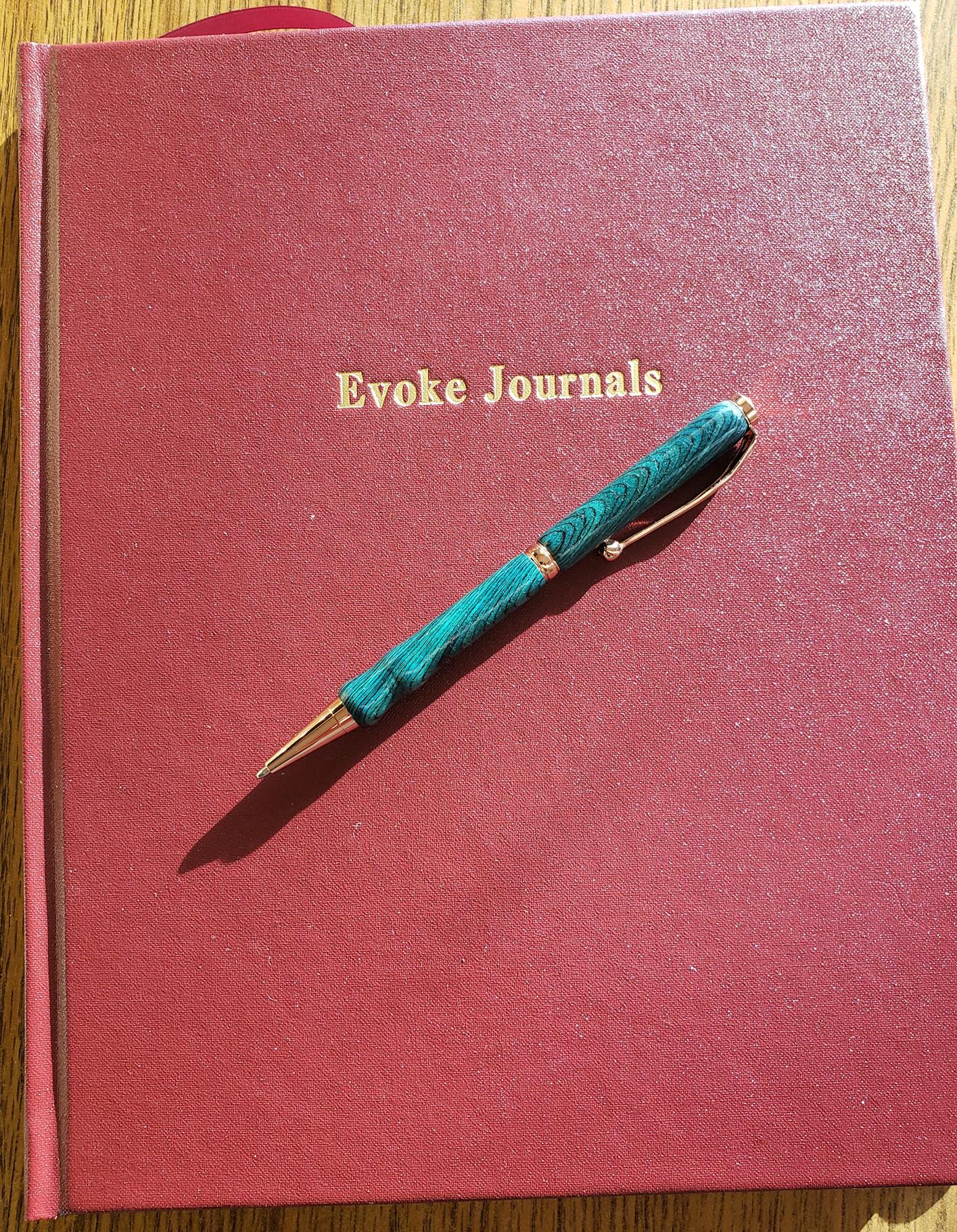 Evoke Journal with Red imitation leather cover and green pen