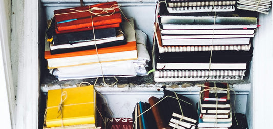   Stacks of journals. Photo by Julia Joppien on Unsplash.com